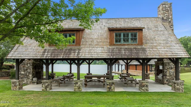 a building outdoor space with patio furniture and potted plants