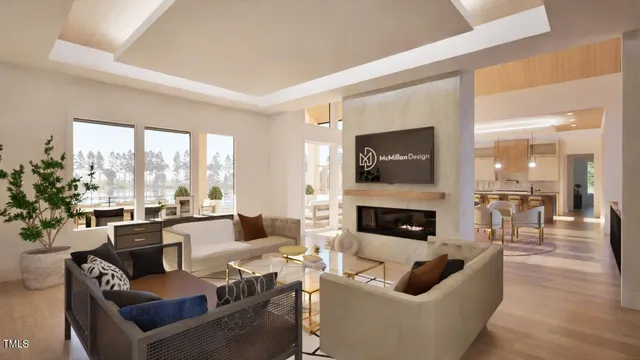 a living room with furniture fireplace and a large window