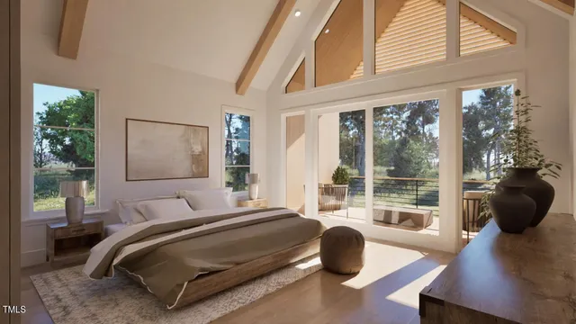 a bedroom with a bed and a large window