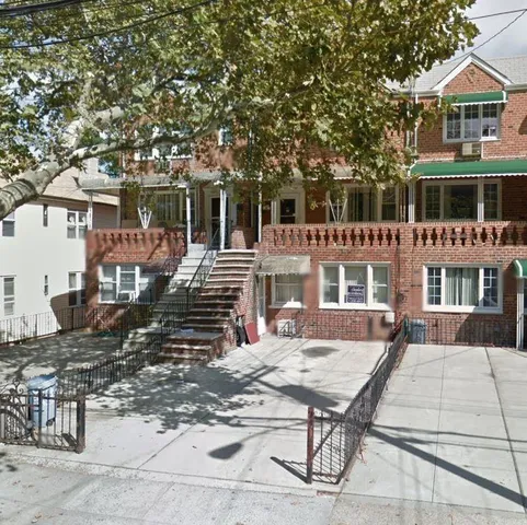 a view of a patio with table and chairs with wooden floor and fence