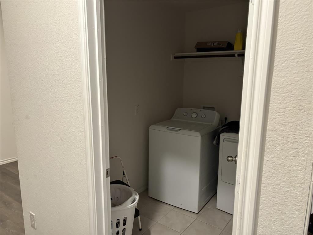3124 Patton Lane Forney, TX 75126 - Photo 12 of 19 a utility room with dryer and washer