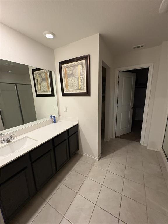 3124 Patton Lane Forney, TX 75126 - Photo 13 of 19 a spacious bathroom with a double vanity sink a mirror and a