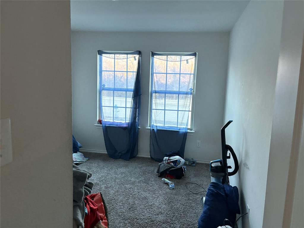 3124 Patton Lane Forney, TX 75126 - Photo 15 of 19 a room with furniture and two windows