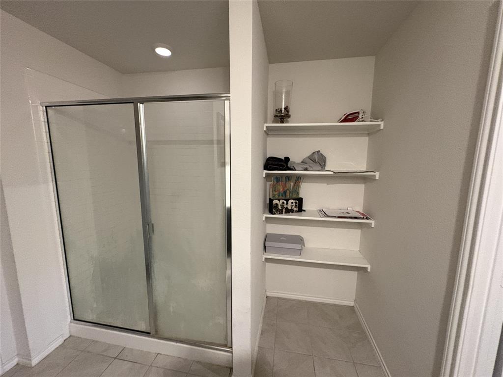 3124 Patton Lane Forney, TX 75126 - Photo 4 of 19 a kitchen with white cabinets and white appliances