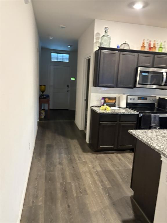 3124 Patton Lane Forney, TX 75126 - Photo 6 of 19 a kitchen with stainless steel appliances granite countertop a stove a sink and a microwave