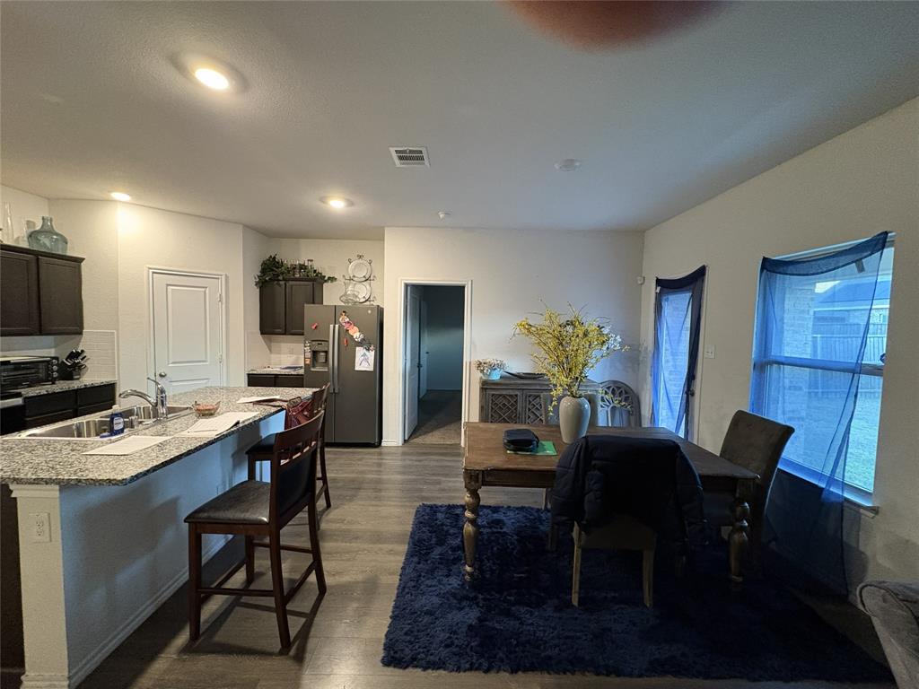 3124 Patton Lane Forney, TX 75126 - Photo 9 of 19 a view of a dining room with furniture