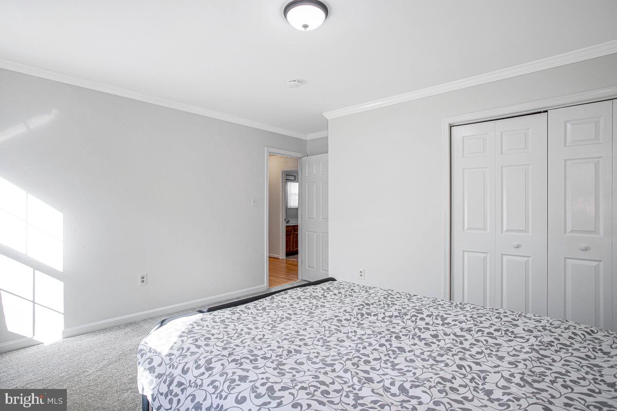 9230 Sam Owing's Place Owings, MD 20736 - Photo 26 of 44 a bedroom with a bed and a window