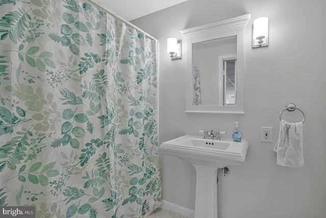 a bathroom with a sink and mirror