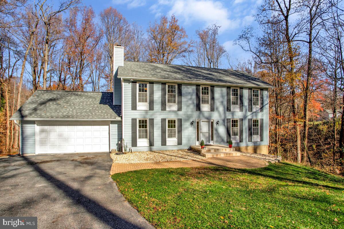 9230 Sam Owing's Place Owings, MD 20736 - Photo 4 of 44 a front view of a house with a yard