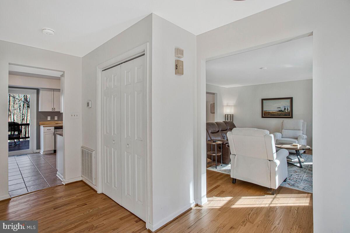 9230 Sam Owing's Place Owings, MD 20736 - Photo 6 of 44 a living room with furniture and a wooden floor