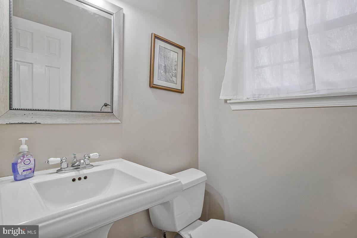 9230 Sam Owing's Place Owings, MD 20736 - Photo 8 of 44 a bathroom with a sink mirror and toilet