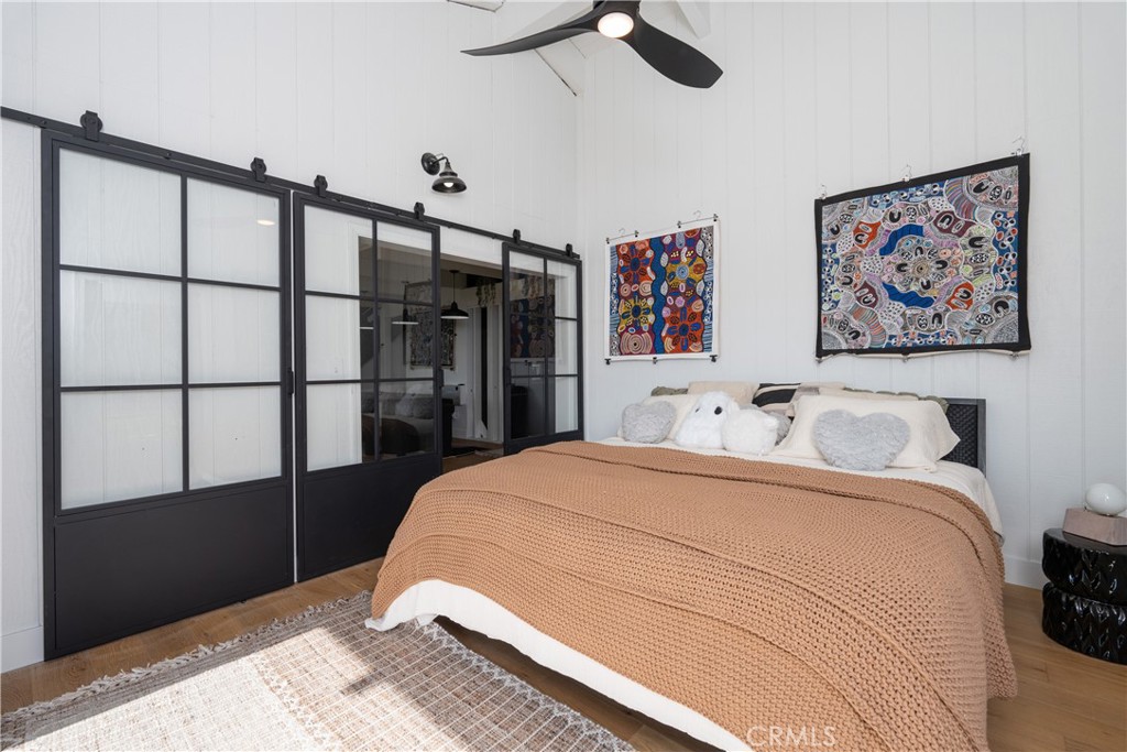 43956 Rocky Ridge Road Coarsegold, CA 93614 - Photo 27 of 58 a bedroom with a bed and a painting on the wall