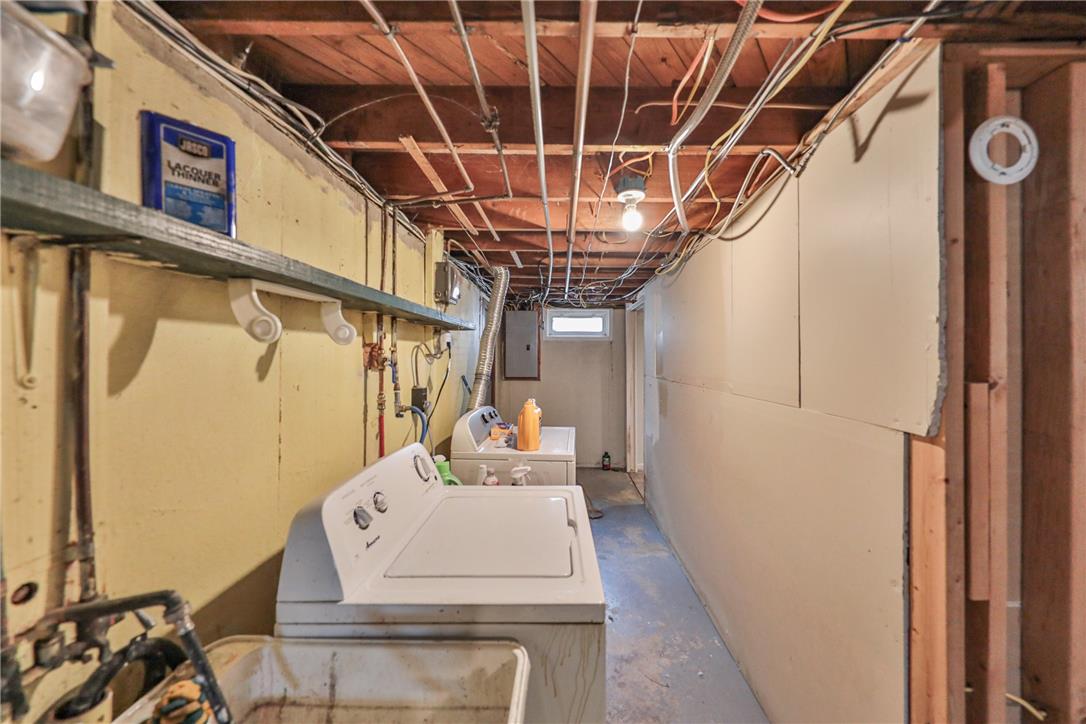 3050 Cornwall Road Bethlehem, PA 18017 - Photo 55 of 80 Functional laundry facilities within an unfinished basement, offering practical utility space.