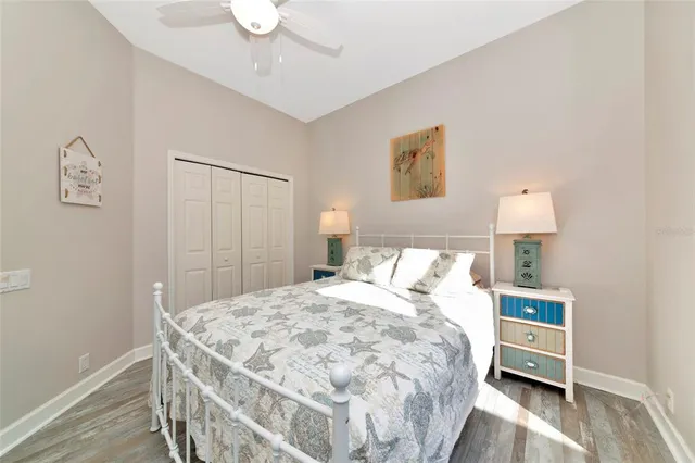 a bedroom with a bed and a lamp on table