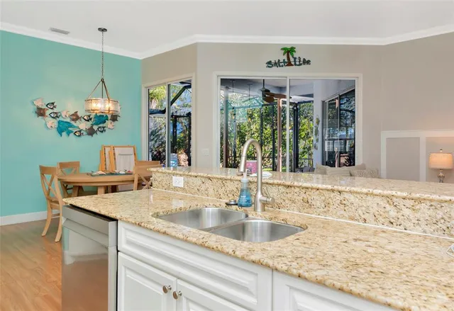 a kitchen with sink and window