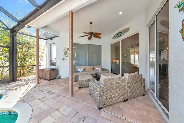 a bedroom with furniture and large windows