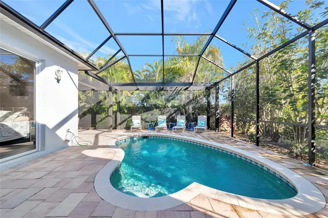 a view of a chairs and table in the balcony