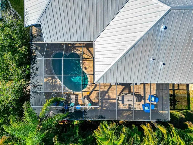a view of house with potted plants