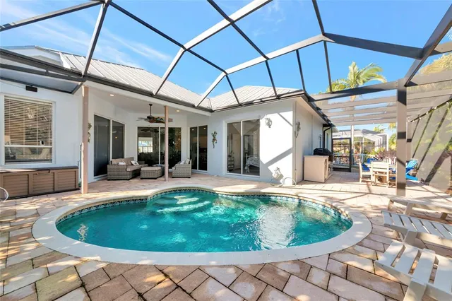 a view of a swimming pool with a patio