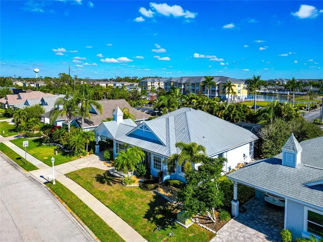 a view of a patio with table and chairs potted plants