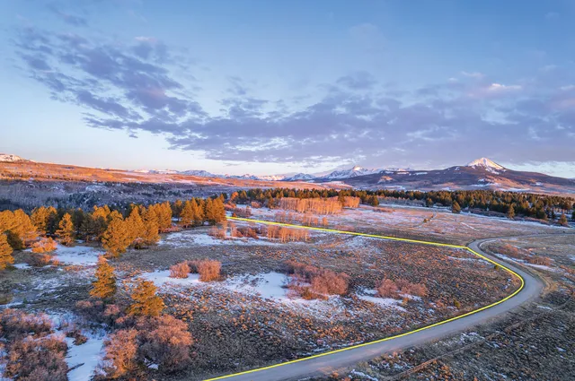 a view of a lake with mountains in the background