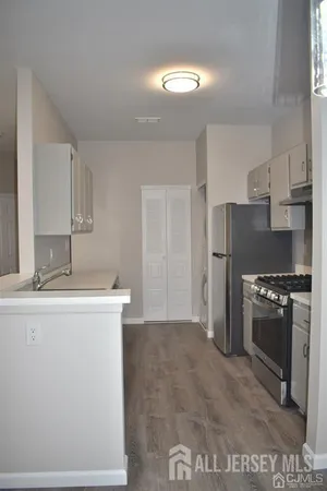a kitchen with a sink and washing machine