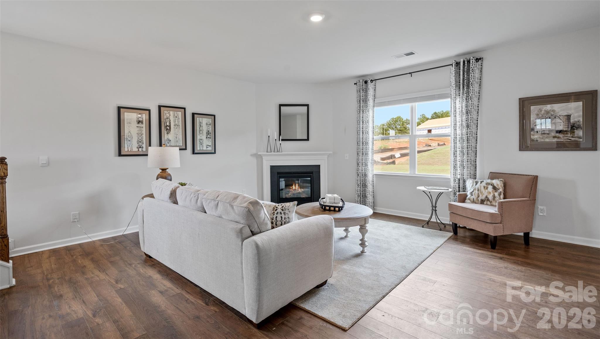 150 Salers Road Fletcher, NC 28732 - Photo 12 of 34 a living room with furniture and a fireplace