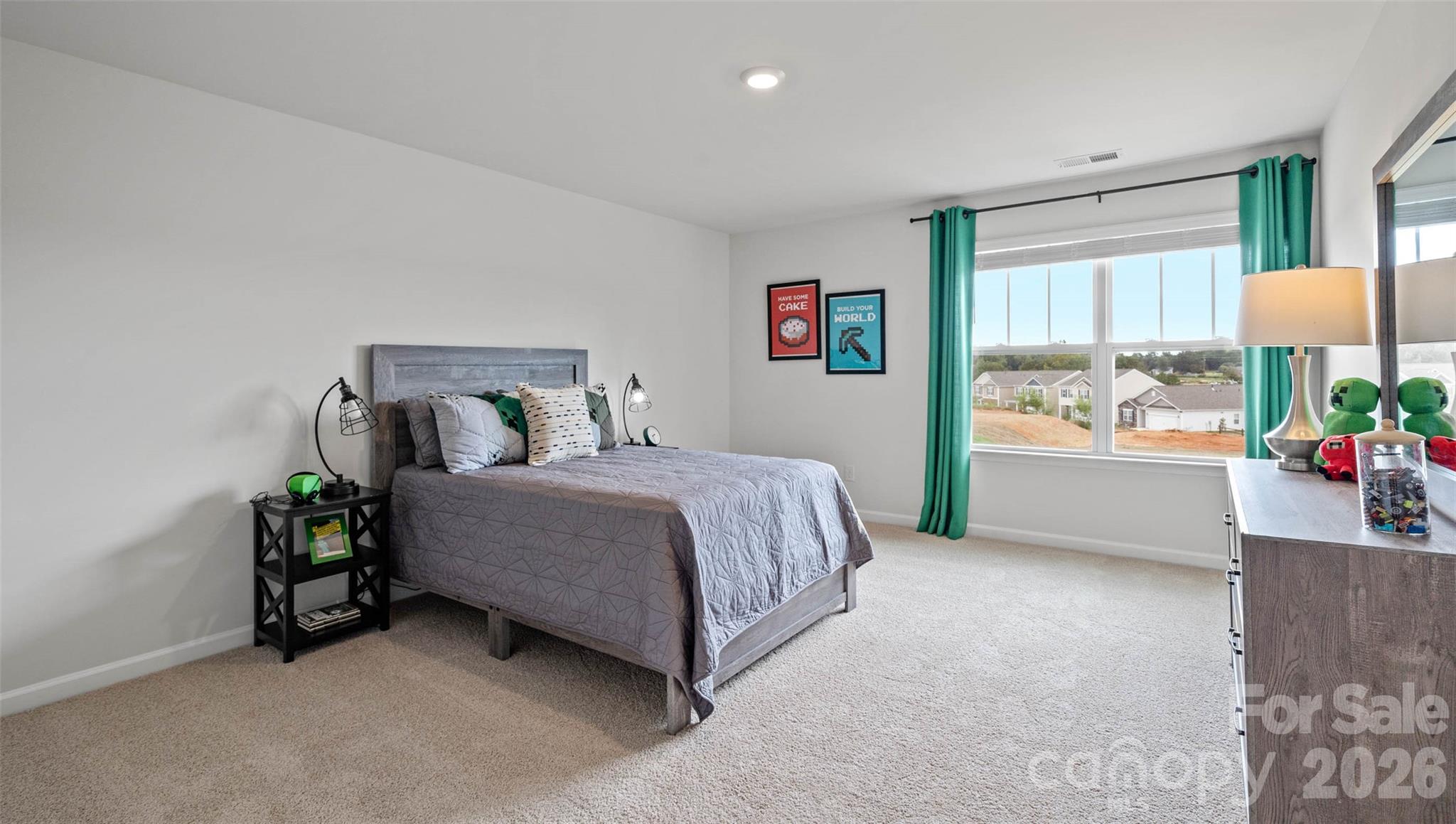 150 Salers Road Fletcher, NC 28732 - Photo 20 of 34 a bedroom with a bed and a window