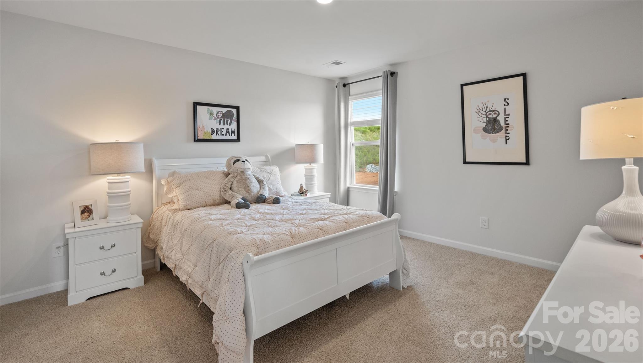 150 Salers Road Fletcher, NC 28732 - Photo 21 of 34 a bedroom with a bed and a night stand