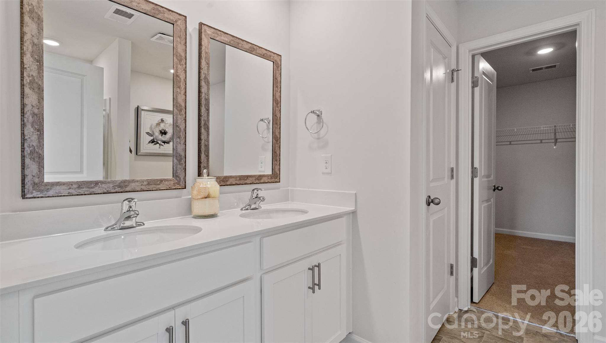 150 Salers Road Fletcher, NC 28732 - Photo 23 of 34 a bathroom with a sink double vanity and a mirror
