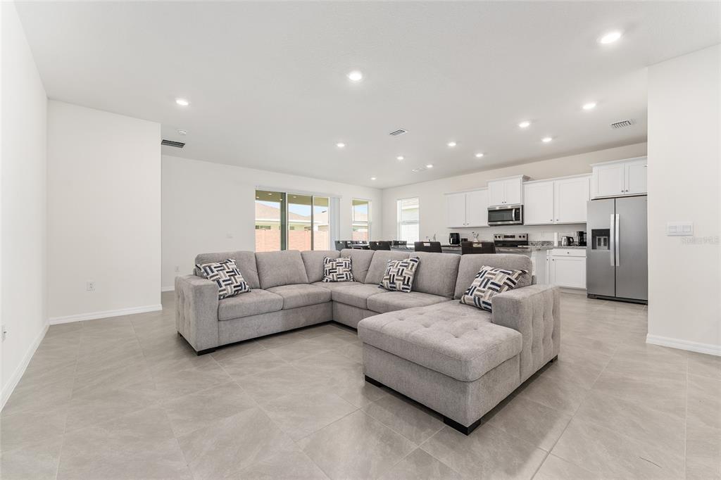 4098 Northwest 48th Terrace Ocala, FL 34482 - Photo 11 of 58 a living room with furniture and kitchen view