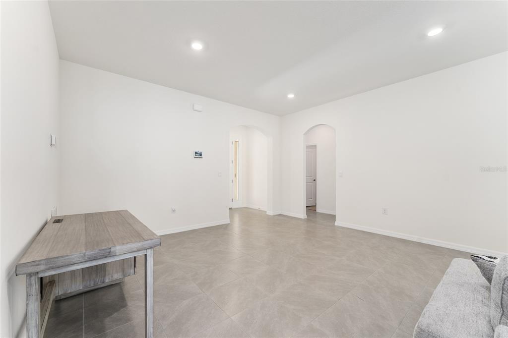 4098 Northwest 48th Terrace Ocala, FL 34482 - Photo 12 of 58 an empty room with a natural light