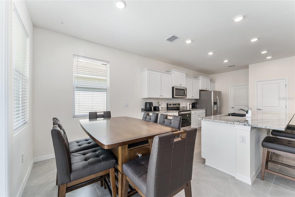 4098 Northwest 48th Terrace Ocala, FL 34482 - Photo 24 of 58 a view of a dining room with furniture and a window