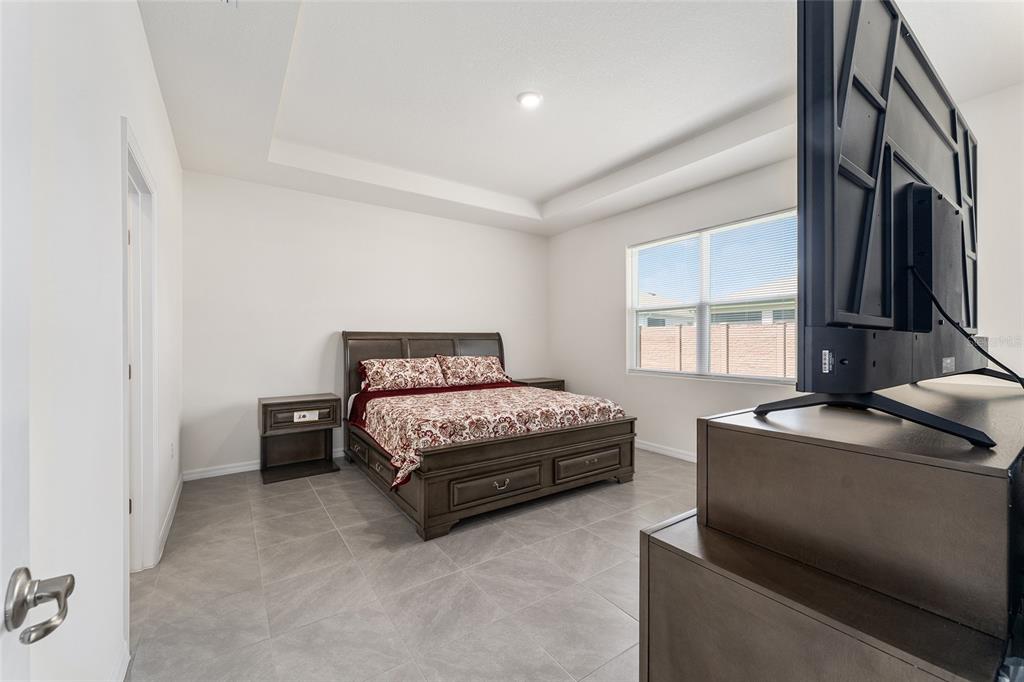 4098 Northwest 48th Terrace Ocala, FL 34482 - Photo 27 of 58 a bedroom with a bed and a window