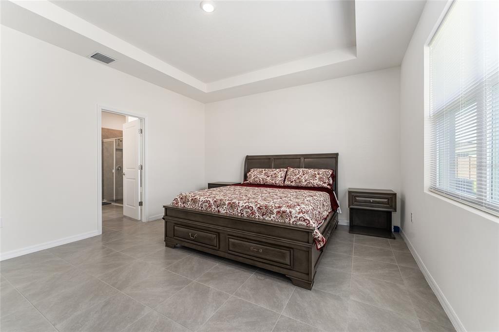 4098 Northwest 48th Terrace Ocala, FL 34482 - Photo 29 of 58 a bedroom with a bed and a window