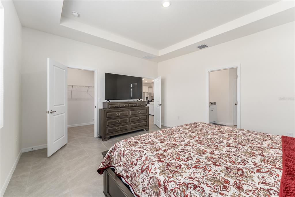 4098 Northwest 48th Terrace Ocala, FL 34482 - Photo 30 of 58 a bedroom with a bed and a television