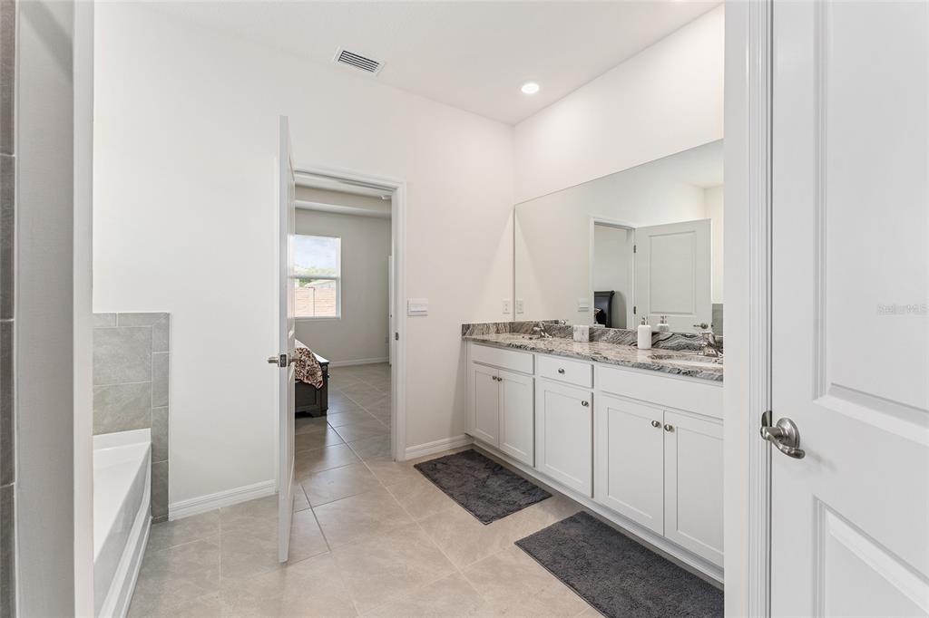 4098 Northwest 48th Terrace Ocala, FL 34482 - Photo 34 of 58 a room with a sink and a mirror