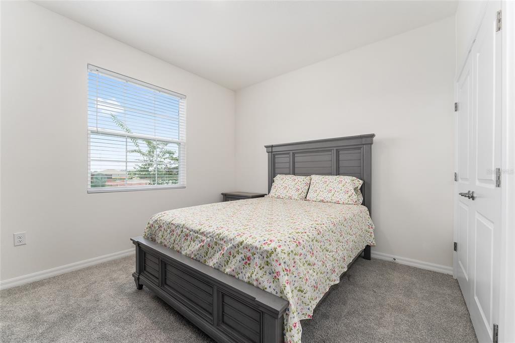 4098 Northwest 48th Terrace Ocala, FL 34482 - Photo 46 of 58 a bedroom with a bed and window