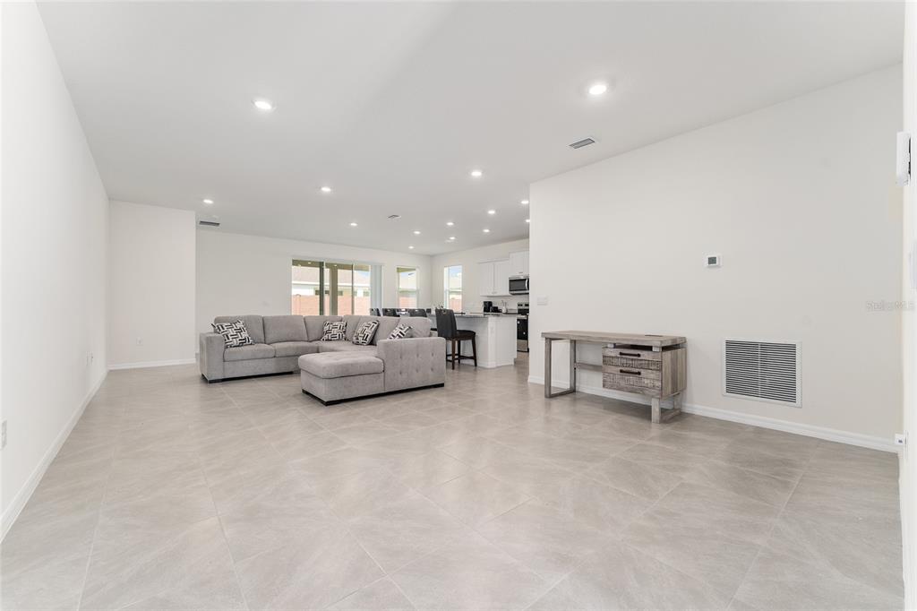 4098 Northwest 48th Terrace Ocala, FL 34482 - Photo 7 of 58 a living room with furniture and a table