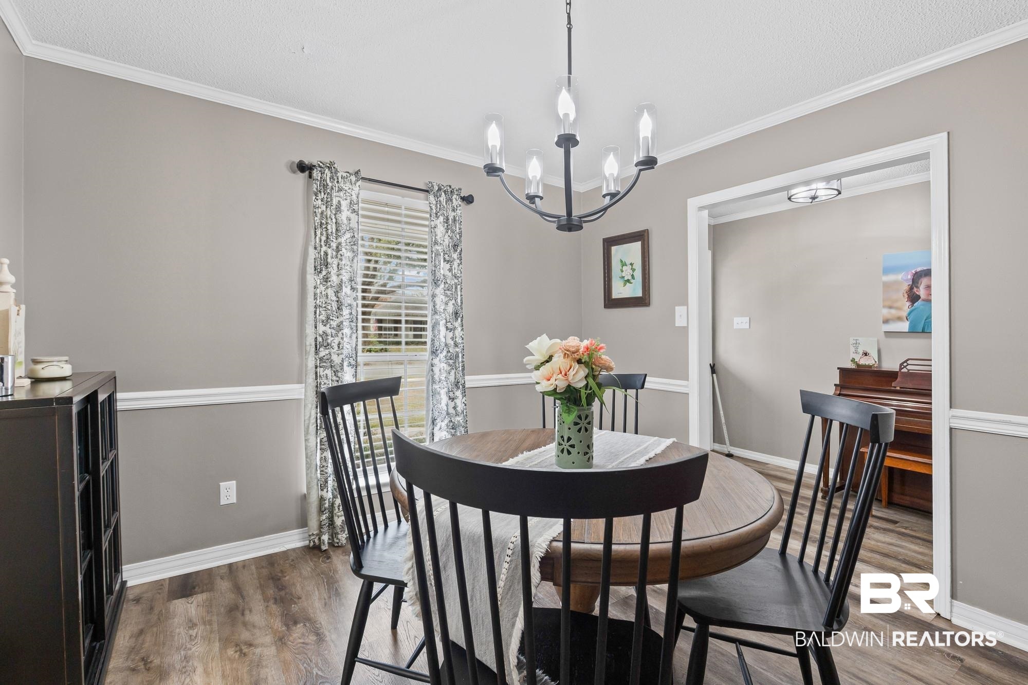 6609 Blakeley Court Mobile, AL 36695 - Photo 4 of 28 Dining room with ornamental molding, suspended lighting, and wood finished floors