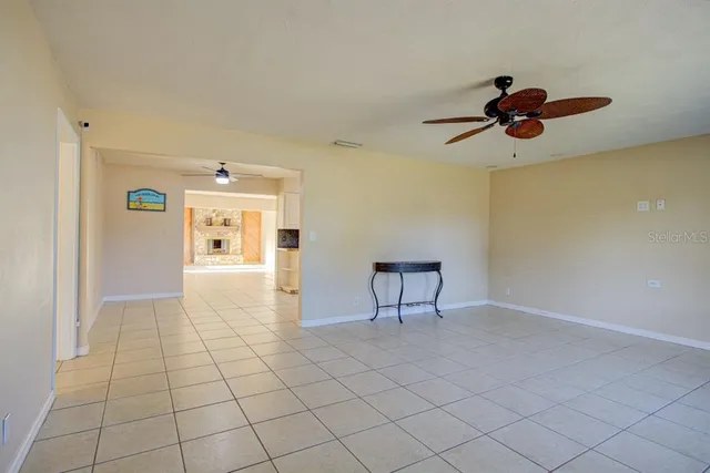a kitchen with granite countertop a stove a sink and a refrigerator