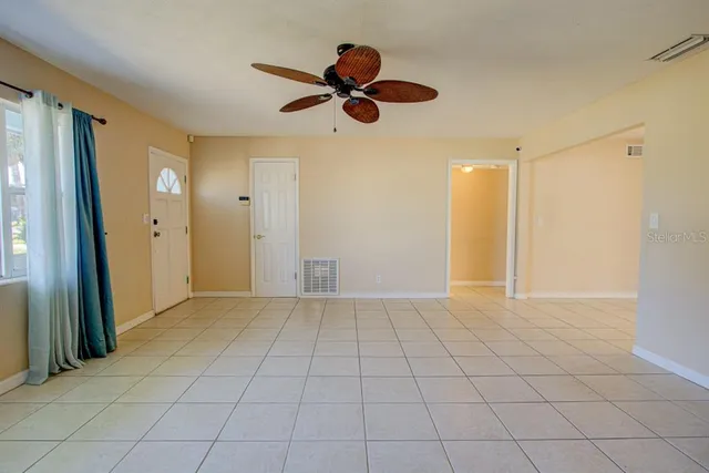 a kitchen with stainless steel appliances granite countertop a refrigerator and a stove