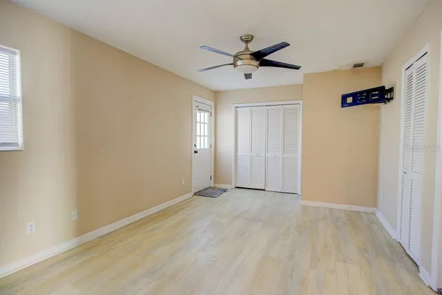 a bathroom with a window and a shower curtain