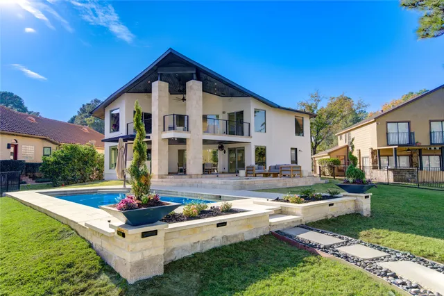 a front view of house with yard and outdoor seating