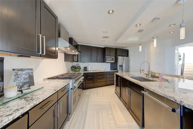 a spacious bedroom with a bed and a flat screen tv