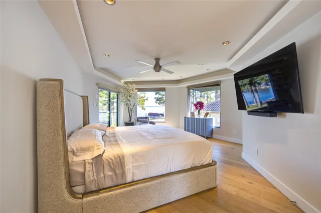 a bedroom with furniture and a flat screen tv