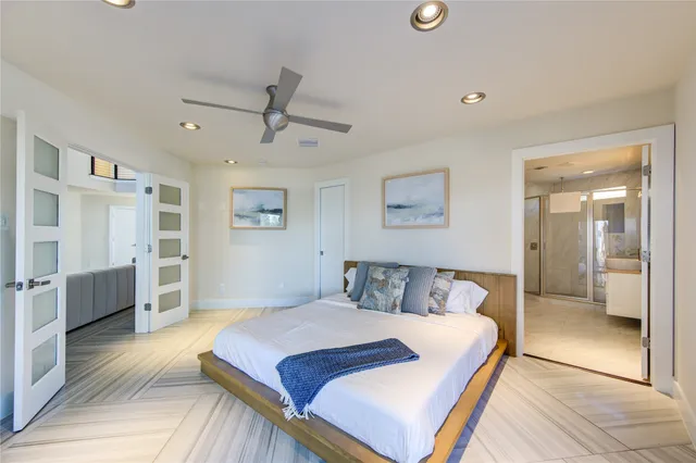a bathroom with a granite countertop sink a toilet and shower