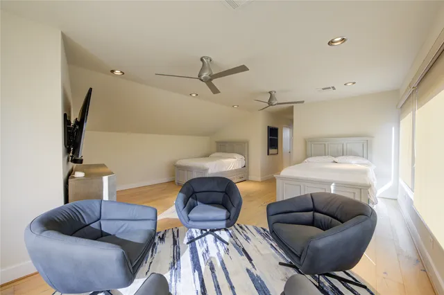 a living room with furniture and a lamp