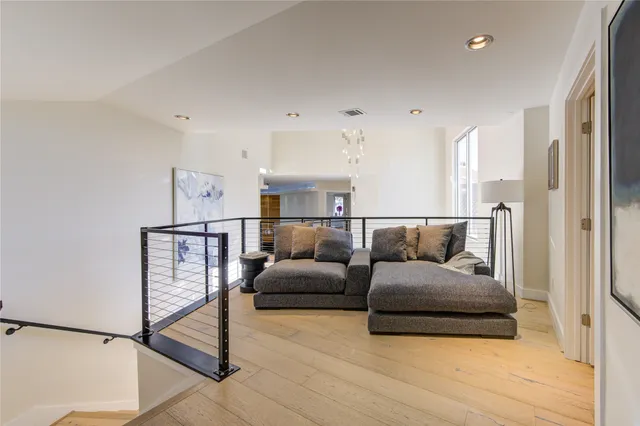 a spacious bathroom with a double vanity sink mirror and toilet