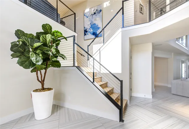 a vase of flowers sitting on a floor